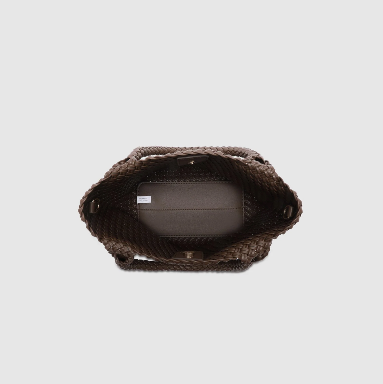 Textured brown woven bag on a light gray background